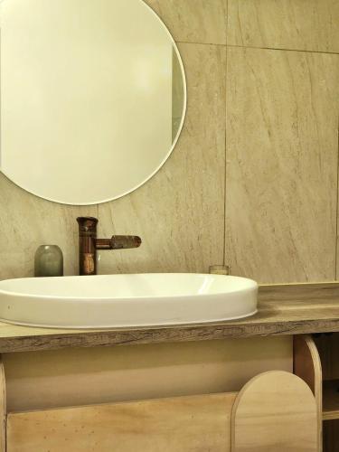 a bathroom with a white sink and a mirror at Private room in shared apartment in Toulouse