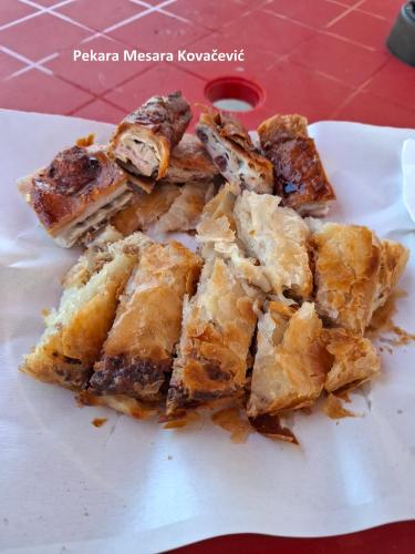 a pile of food sitting on top of a white plate at Apartmani Kovačević MKM Banja Vrujci in Gunjica