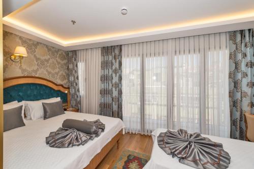 Katil atau katil-katil dalam bilik di Aprilis Gold Hotel - Special Category