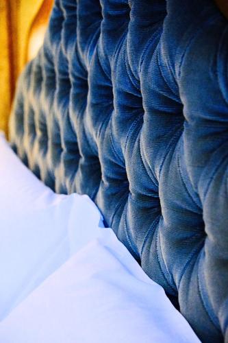 a close up of the side of a blue rooster at H O T E L S A N G A L L O l in Venice