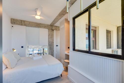 Giường trong phòng chung tại Duplex Aloha Playa 1018