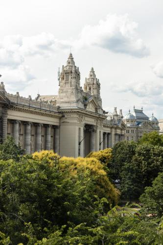 a large building with trees in front of it at Verno House Budapest, Vignette Collection by IHG in Budapest