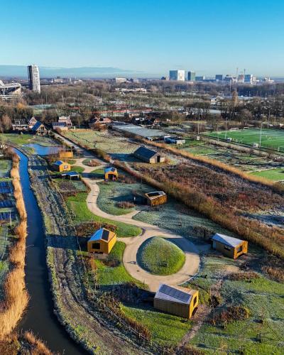 an aerial view of a river with houses and buildings at Waterlinie Lodges in Utrecht