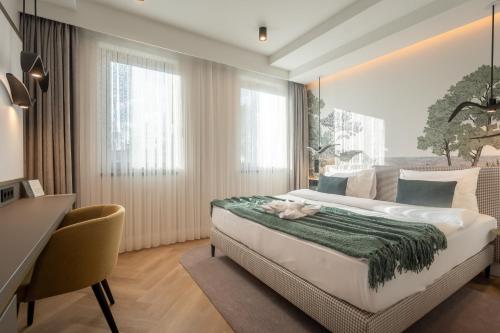 Voodi või voodid majutusasutuse Larum Balatonfüred - Adults only toas