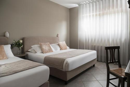 Cama o camas de una habitación en Hotel Don Luis