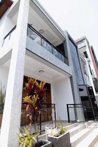 a building with a balcony with plants on it at MARA Apartments in Gisenyi
