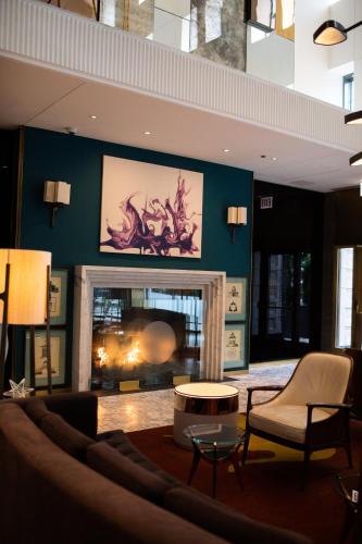 a living room with a fireplace and a couch at Viceroy Chicago in Chicago
