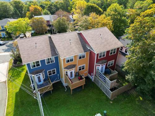 an aerial view of a house with colorful houses at Freshwater Joys Jellybean 4br Gem In St John's in St. John's