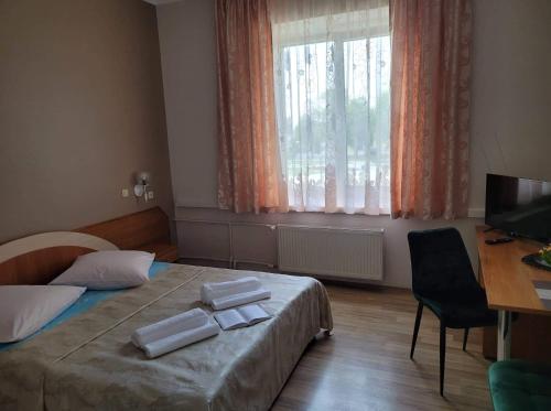 Postel nebo postele na pokoji v ubytování Svečių namai RASA