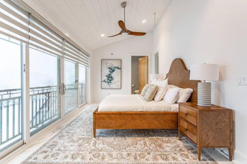 a bedroom with a bed and a balcony at Huge Equestrian Estate Indoor Pool, Theater, Game Rm in Schoharie