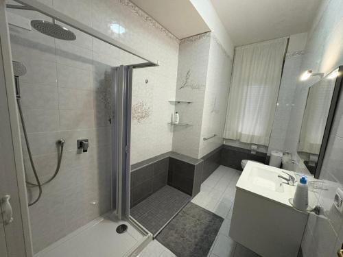 a bathroom with a shower and a sink at Stefano's house in Siracusa