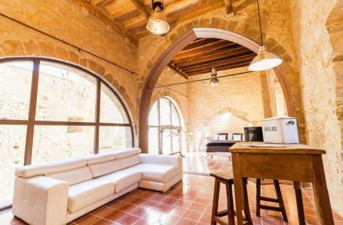 Posezení v ubytování AS Palau dels Alemanys Suites Boutique Monument
