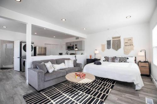 a large bedroom with a bed and a couch at The Barber Loft-Close to Downtown 35 Mins to Ski in Salt Lake City