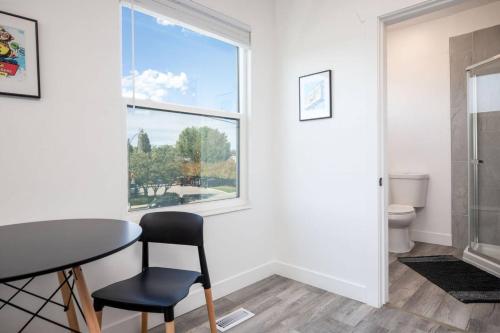 a dining room with a table and a window at The Barber Loft-Close to Downtown 35 Mins to Ski in Salt Lake City