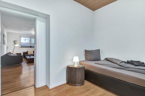 a bedroom with a bed and a living room at 24-7 Living - Modern Apartments in Waltrop with Top Connection in Waltrop