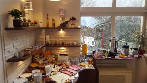 a kitchen with a bunch of food on a counter at Hotel Romantik Eger in Eger