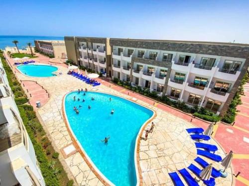 an aerial view of a hotel with a swimming pool at Elite apartment private beach Holiday Chalet Free WIFI in Hurghada