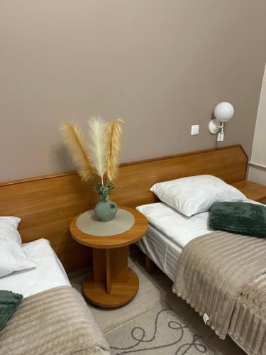Postel nebo postele na pokoji v ubytování Svečių namai RASA