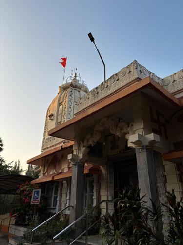 a building with two flags on top of it at Hireath! in Kelve Road