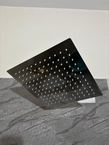 a black object with white dots on a table at Hireath! in Kelve Road
