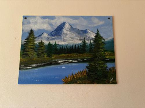 a painting of a mountain and a lake at Hireath! in Kelve Road