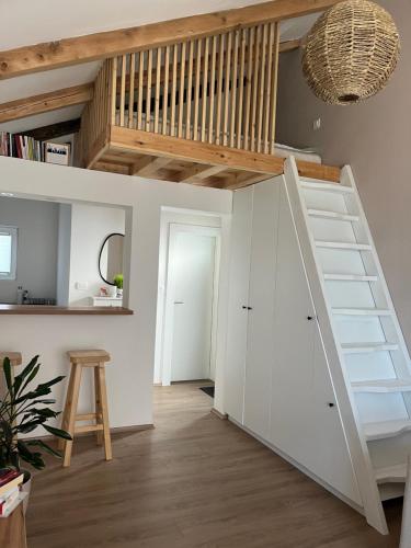 a room with a loft bed and a staircase at Guest house TAK in Cetinje
