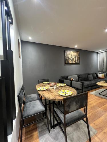 a living room with a table and a couch at ABM house in Tangier