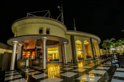 a building with a black and white tiled floor at Hurghada Mirage Bay Hotel & Aquapark in Hurghada