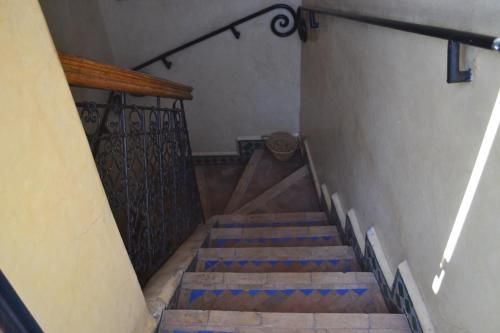 a stairway with blue and brown stairs in a building at Riad Hôtel Belleville Marrakech in Marrakech