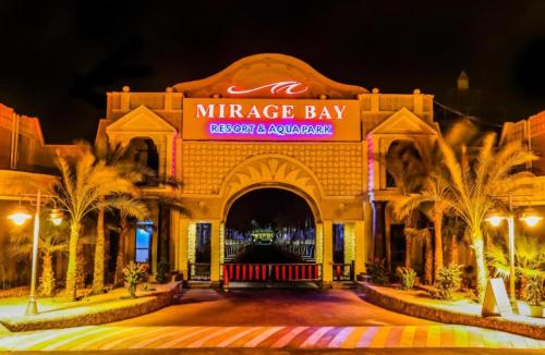 a entrance to a mireggie bay at night at Hurghada Mirage Bay Hotel & Aquapark in Hurghada
