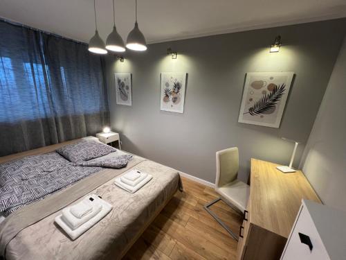 Ένα ή περισσότερα κρεβάτια σε δωμάτιο στο Apartament Galactica