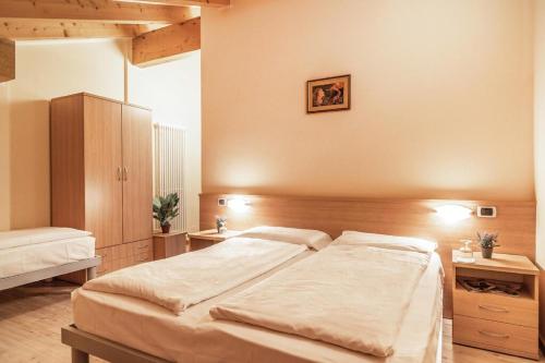 Ein Bett oder Betten in einem Zimmer der Unterkunft Hotel Garnì Maria