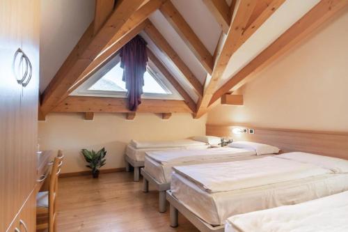 Postel nebo postele na pokoji v ubytování Hotel Garnì Maria