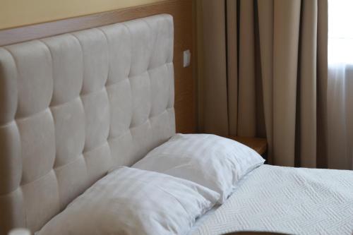 Postel nebo postele na pokoji v ubytování Hotel Ternopil