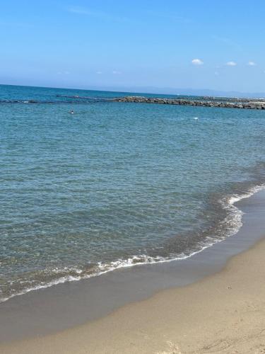 a view of the ocean with a sandy beach at Alloggio by the sea in Focene