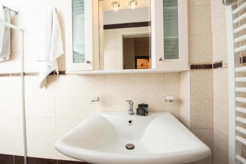 a bathroom with a white sink and a mirror at Villa Agrilida in Vasiliki