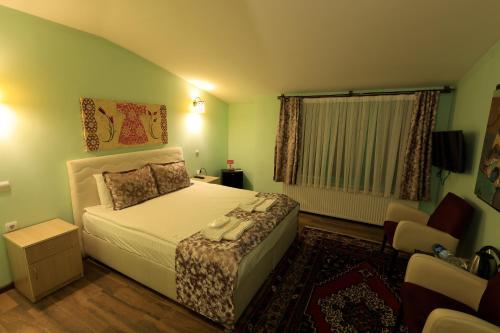 Кровать или кровати в номере KEMAL STONE HOUSE HOTEL.
