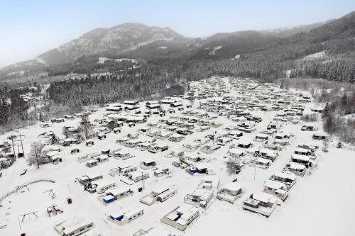 an aerial view of a parking lot covered in snow at First Camp Gol Hallingdal in Gol