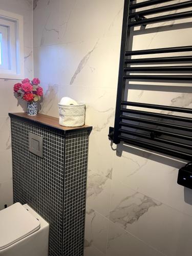 Ένα μπάνιο στο B&B bij de Roosjes