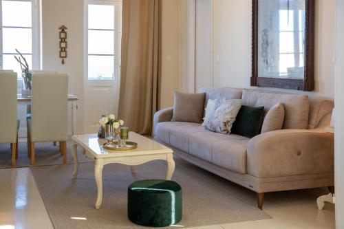 a living room with a couch and a table at "Vela" Symi Village Residences in Symi