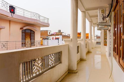 an empty corridor of a building with a balcony at Usha Residency in Varanasi