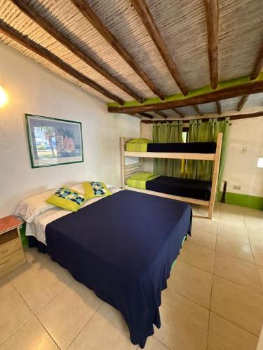 Ένα ή περισσότερα κρεβάτια σε δωμάτιο στο Posada Caribbean House
