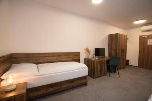 Postel nebo postele na pokoji v ubytování Wellness Hotel Zavadilka