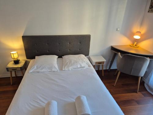 Ένα ή περισσότερα κρεβάτια σε δωμάτιο στο Appartement luxueux 100m² Bordeaux