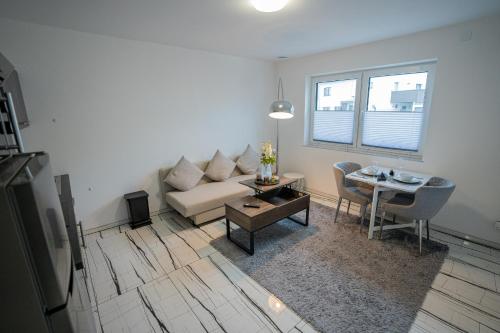 a living room with a couch and a table at Feel like Home 1 in Biberach an der Riß
