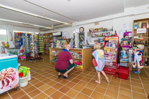 a group of people shopping in a store at Eix Platja Daurada Hotel & SPA in Can Picafort