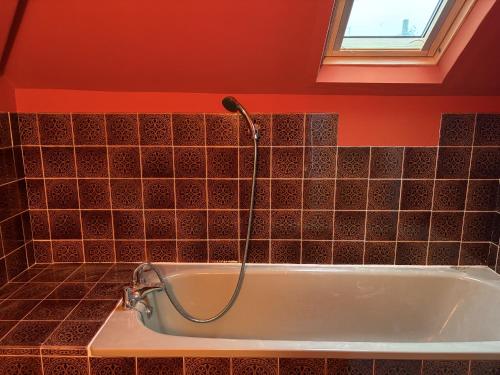 a shower in a bathroom with a tub at Lynchway in Lyme Regis