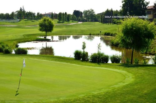 a view of a golf course with a pond at B&B La Casa di Rita in Castrezzato