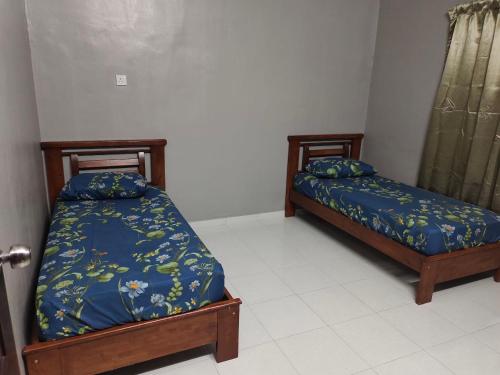 Кровать или кровати в номере DeStay Taiping