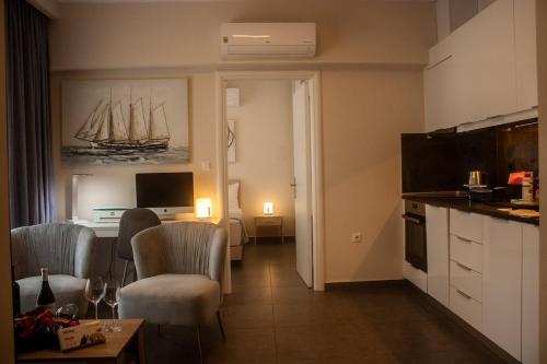 a living room with a kitchen and a room with a dining room at Arfaras Home in Ixia